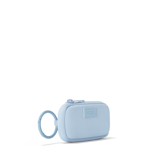 Dagne Dover Mara Keychain in an airy, lighter sky blue seen from an angle.
