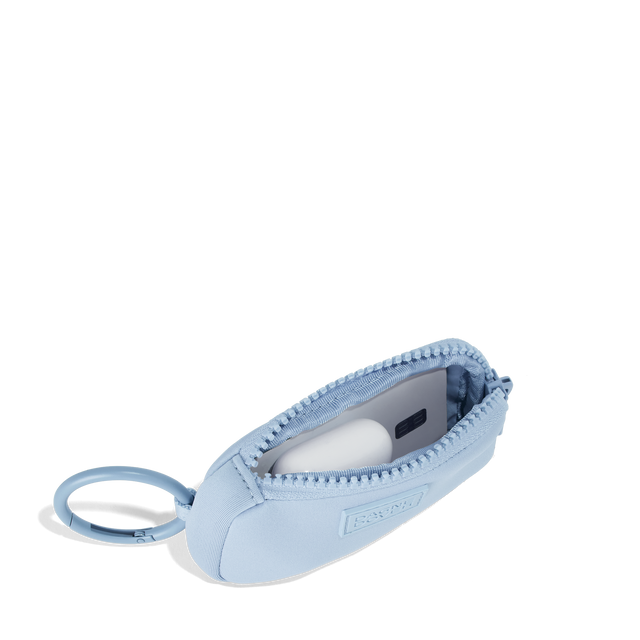 Dagne Dover Mara Keychain in an airy, lighter sky blue unzipped, showing interior.
