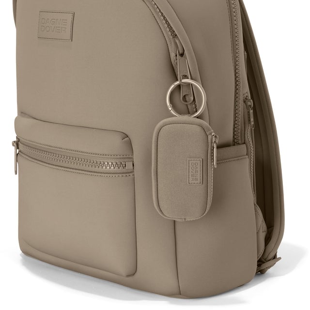 Dagne Dover Mara Keychain in a medium-dark, creamy tan clipped onto a backpack. hover