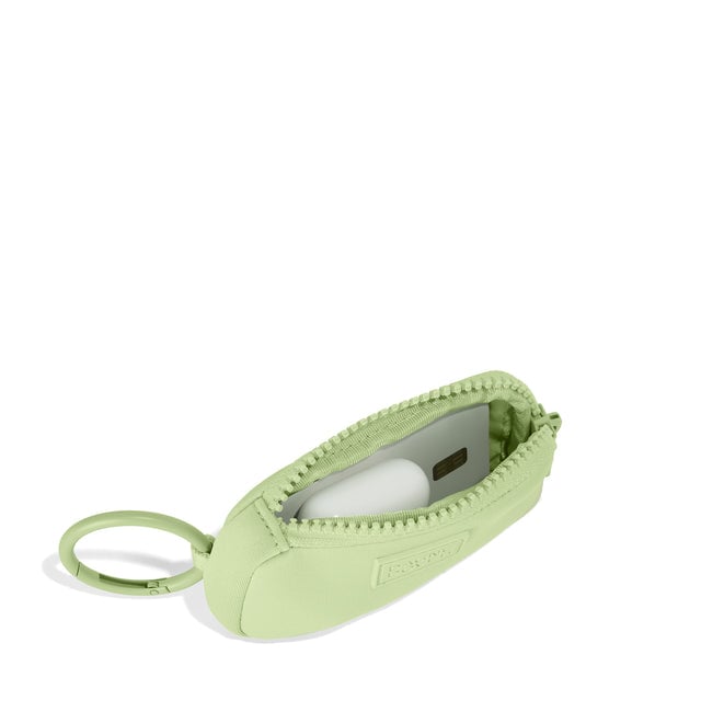 Dagne Dover Mara Keychain in a vibrant, creamy green unzipped, showing interior.