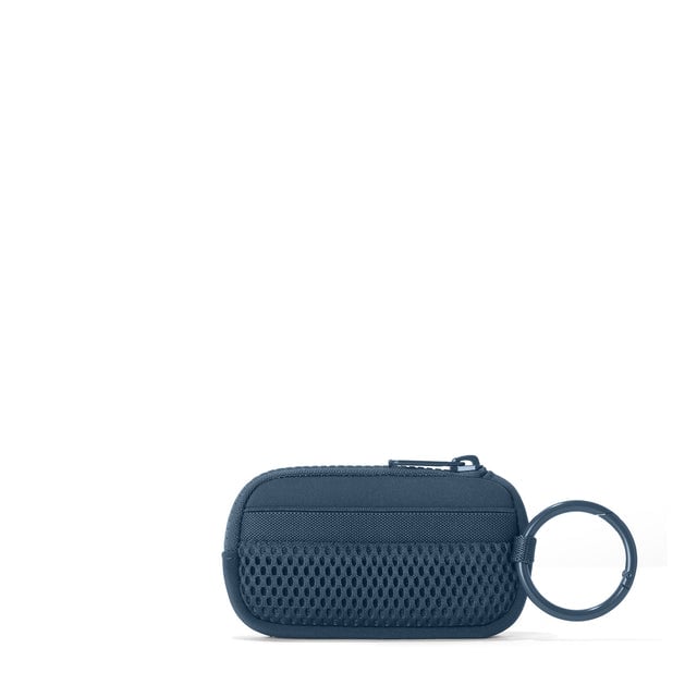 Dagne Dover Mara Keychain in a medium grey-blue with a touch of turquoise seen from the back.
