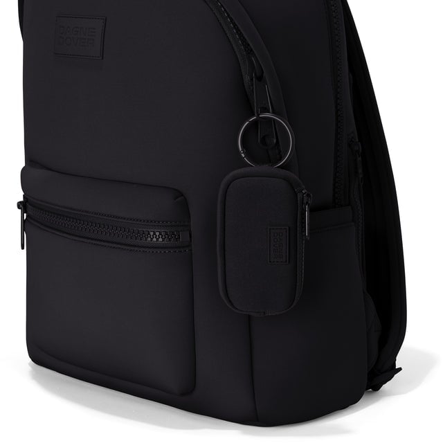 Dagne Dover Mara Keychain in black clipped onto a backpack. hover