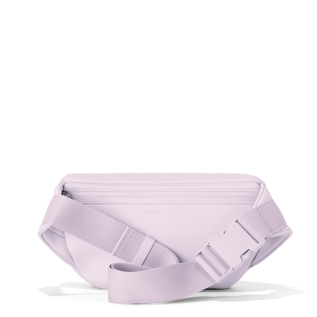 Dagne Dover jax large fanny pack in  a soft purple with grey undertones seen from the back.
