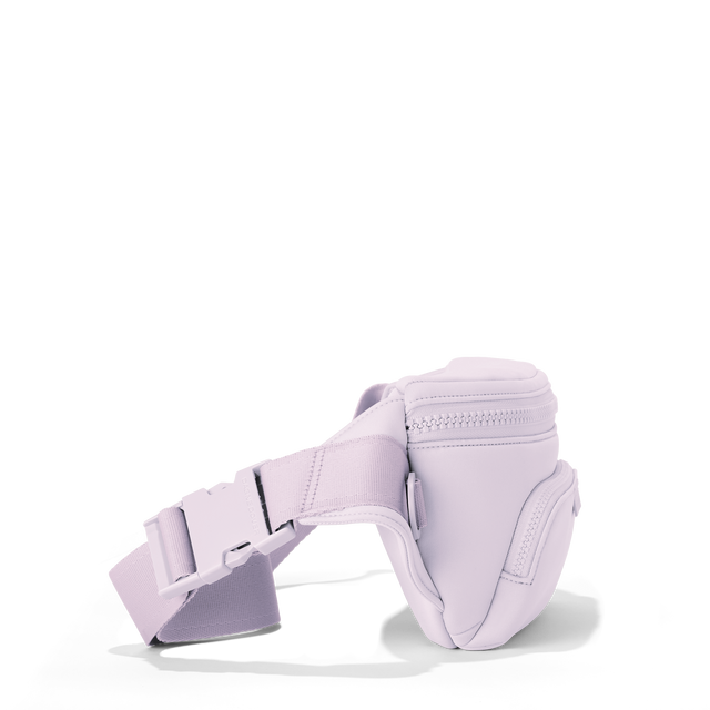 Dagne Dover jax large fanny pack in  a soft purple with grey undertones seen from an angle.
