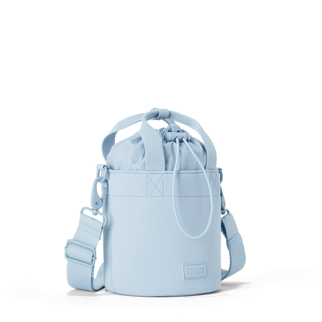 Dagne Dover Nico Bucket Bag in an airy, lighter sky blue, side angle.