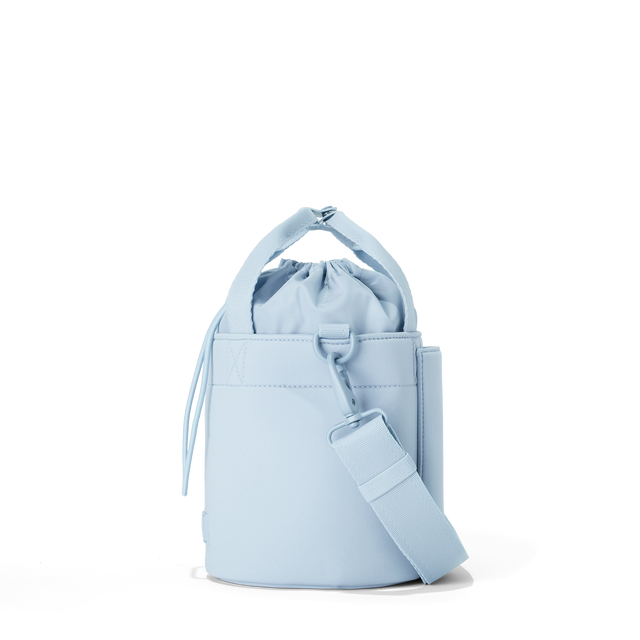 Dagne Dover Nico Bucket Bag in an airy, lighter sky blue, side angle.