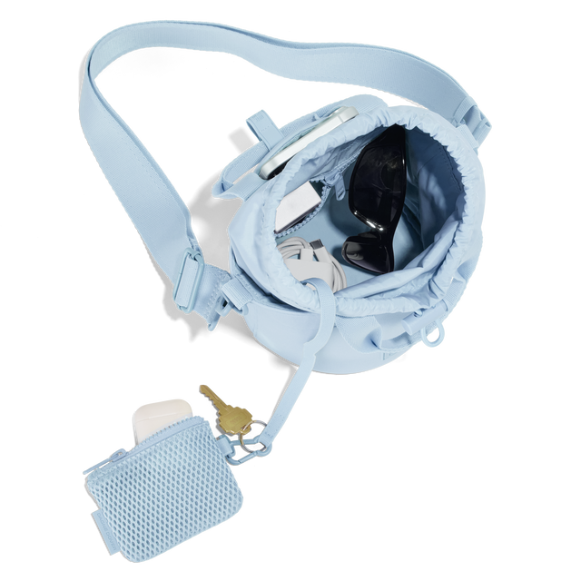 hover Dagne Dover Nico Bucket Bag in an airy, lighter sky blue, topdown.