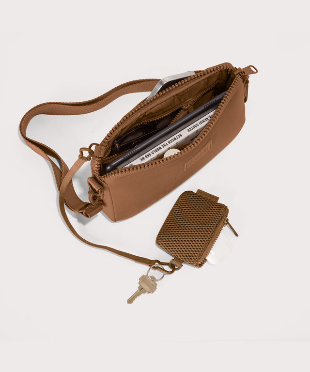 Nora shoulder bag in a saturated, warm medium-brown with burnt orange undertones unzipped, top down view. 

