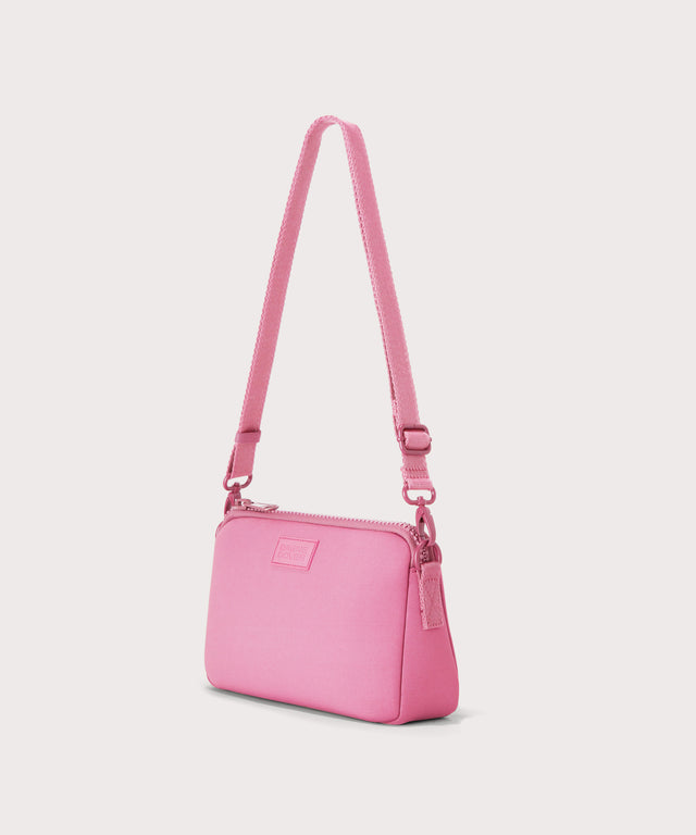 Dagne Dover Nora Shoulder Bag in a true bubble gum pink seen from an angle.