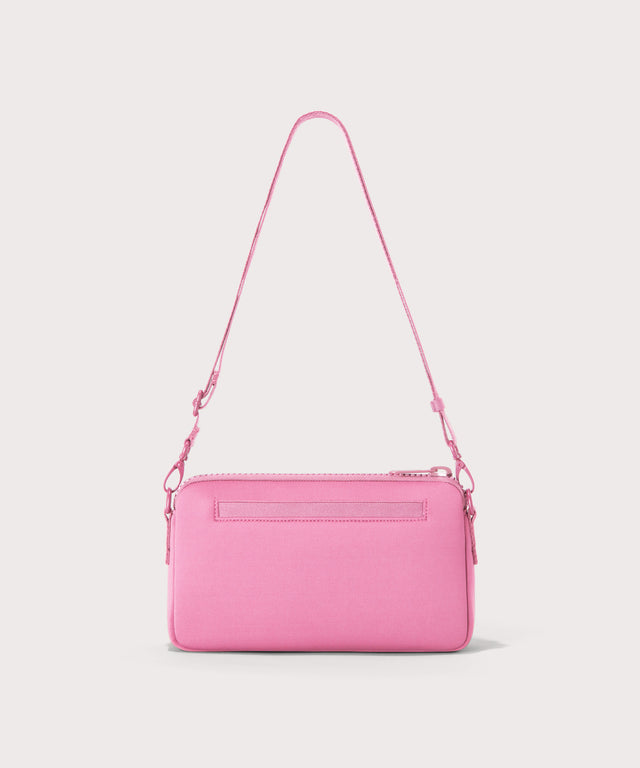 Dagne Dover Nora Shoulder Bag in a true bubble gum pink seen from the back.