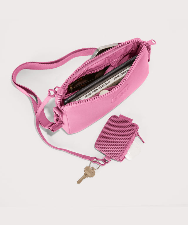 Dagne Dover Nora Shoulder Bag in a true bubble gum pink unzipped, top down view.
