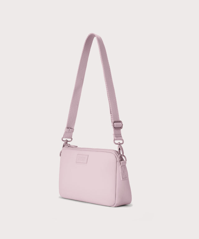Nora shoulder bag in a cool, powdery pink with soft grey undertones., side angle view
