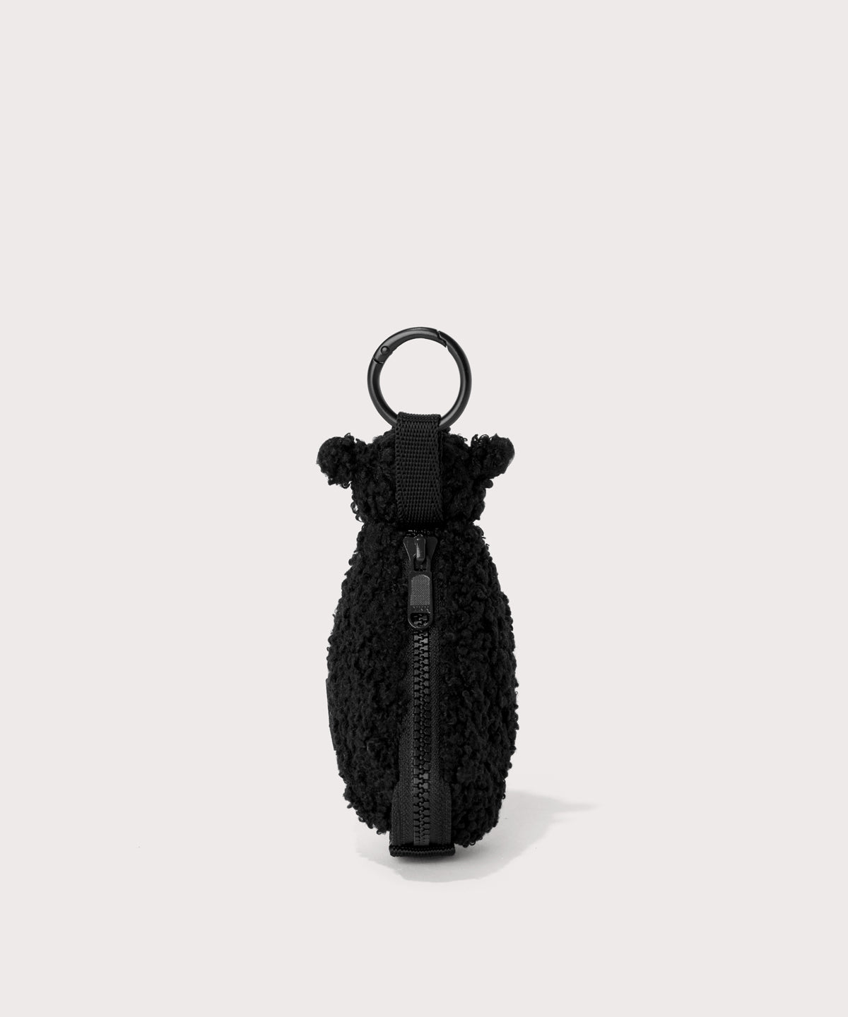 Black sheep keychain in a black In a  Faux Shearling  a soft, wool-like plush made with recycled materials
back view