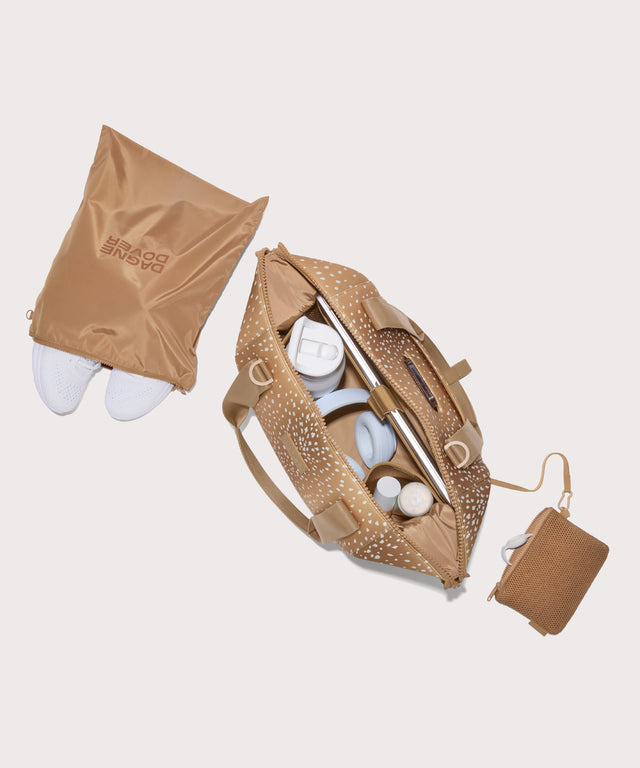 Medium Landon Carryall in an understated, neutral fawn print with a range of rich browns unzipped, top down view. 
