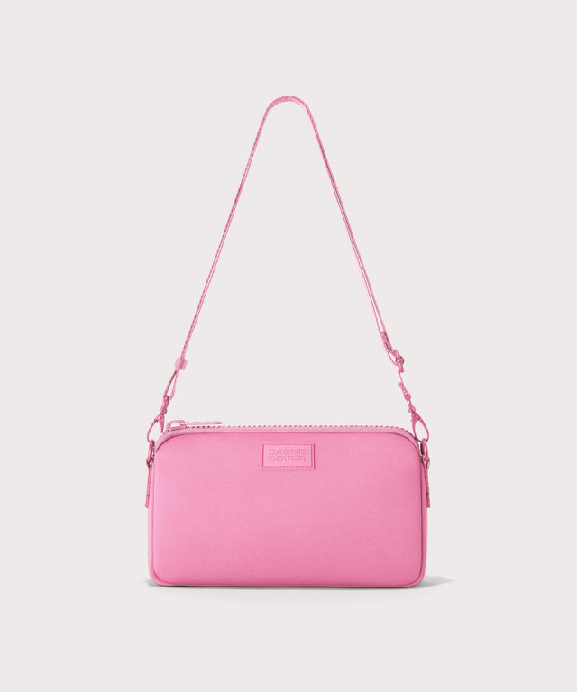 Dagne Dover Nora Shoulder Bag in a true bubble gum pink with the crossbody strap displayed.