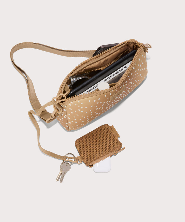 Nora shoulder bag in an understated, neutral fawn print with a range of rich browns unzipped, top down view. 
