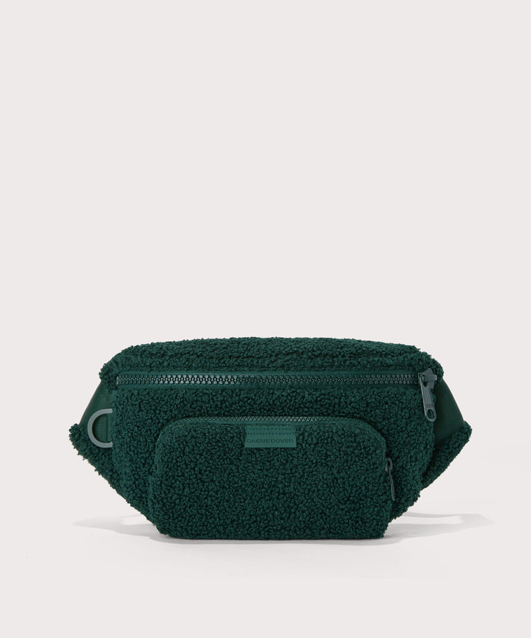 Jax fanny pack in a saturated, jewel-toned deep green with bold blue undertones. In a  Faux Shearling  a soft, wool-like plush made with recycled materials
