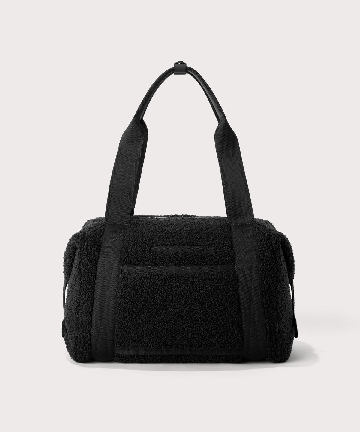 Medium landon carryall in a black.  Back view.  In a  Faux Shearling  a soft, wool-like plush made with recycled materials
