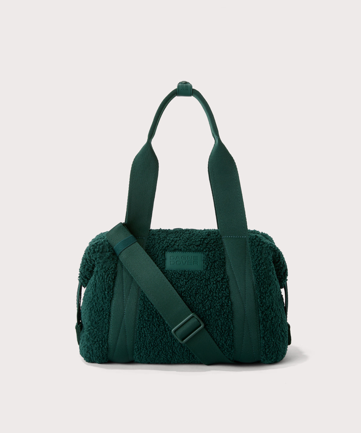 small landon carryall in a saturated, jewel-toned deep green with bold blue undertones. In a  Faux Shearling  a soft, wool-like plush made with recycled materials
