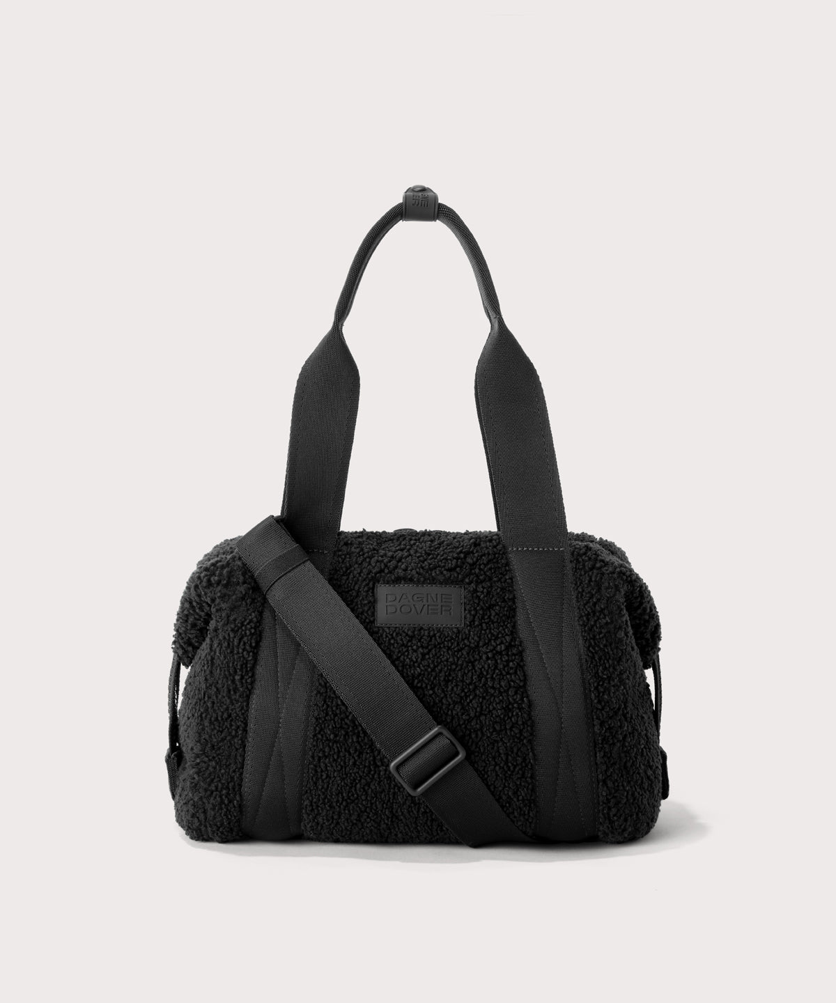 small landon carryall in a black. In a  Faux Shearling  a soft, wool-like plush made with recycled materials
