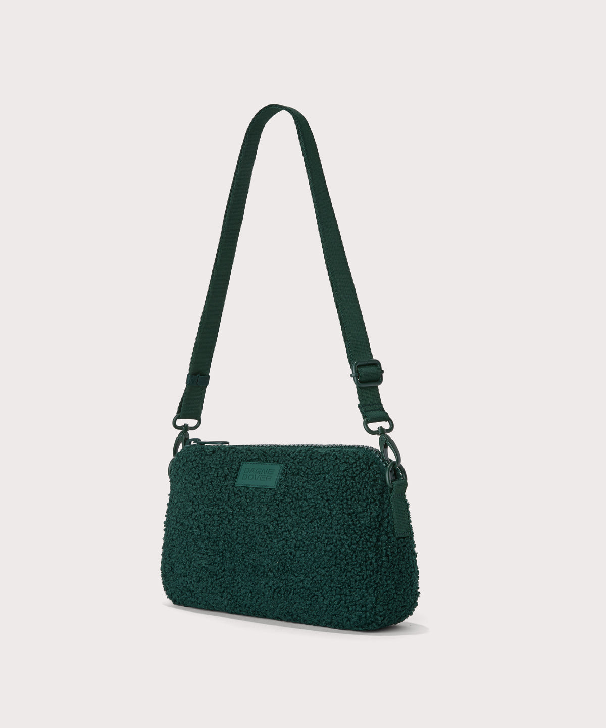 nora shoulder bag in a saturated, jewel-toned deep green with bold blue undertones..  side angle view  In a  Faux Shearling  a soft, wool-like plush made with recycled materials
