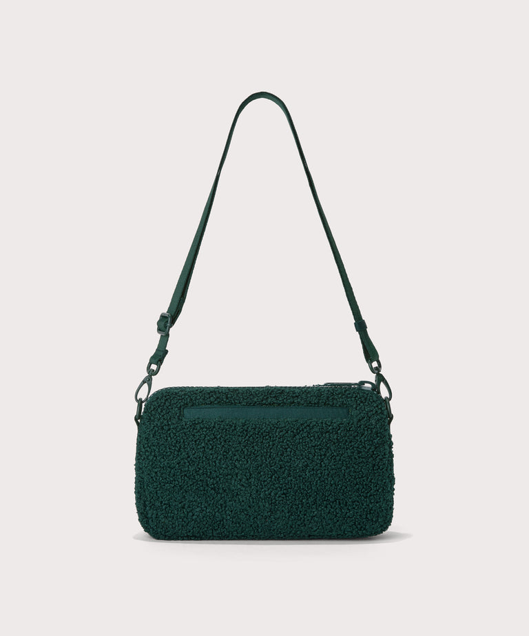 nora shoulder bag in a saturated, jewel-toned deep green with bold blue undertones.  Back view.  In a  Faux Shearling  a soft, wool-like plush made with recycled materials
