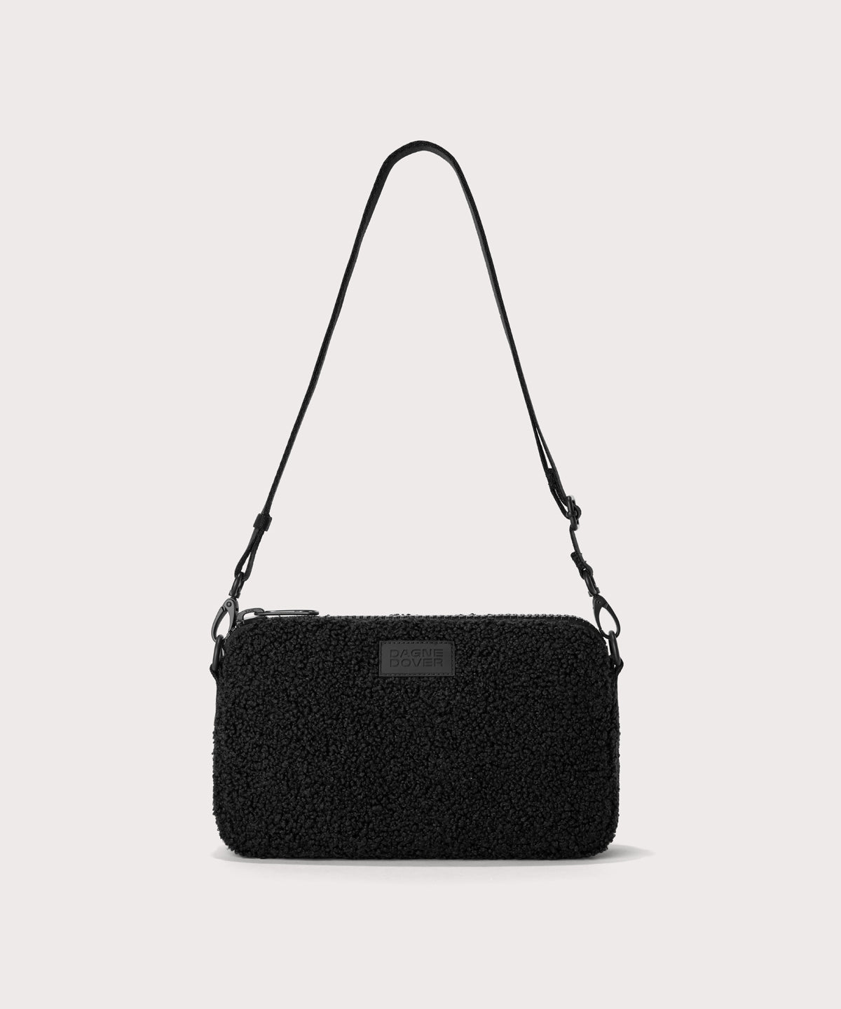 nora shoulder bag in a black. In a  Faux Shearling  a soft, wool-like plush made with recycled materials
