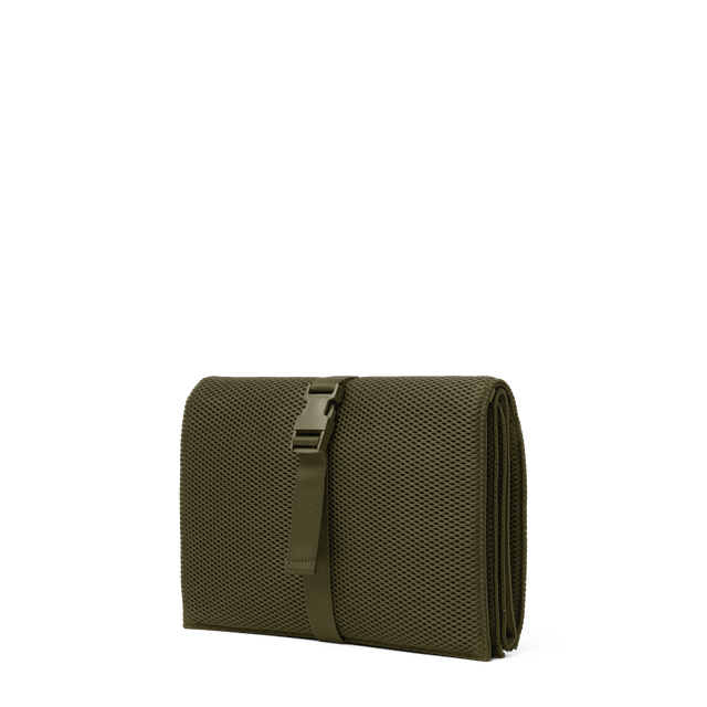 Dagne Dover Joey Changing Kit in dark green seen from an angle.