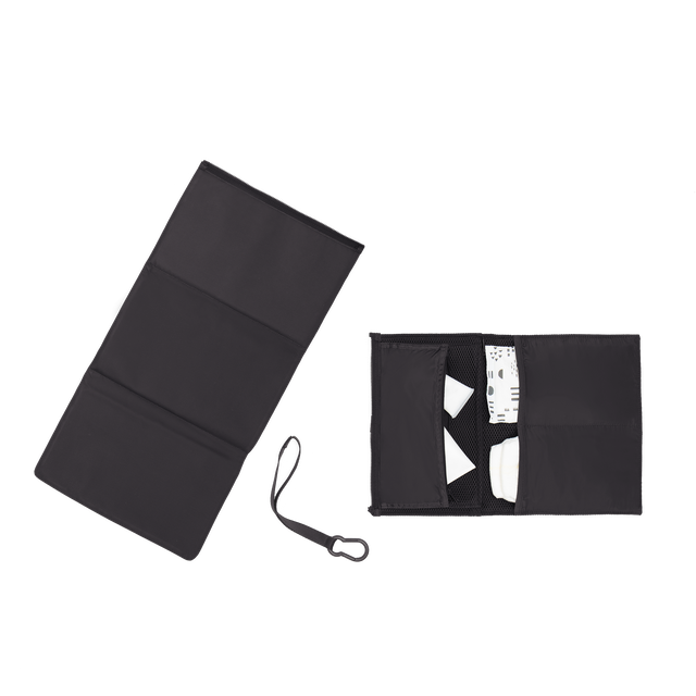 hover - Dagne Dover Joey Changing Kit in black unfolded, revealing the interior zipper pocket and interior slip pockets.