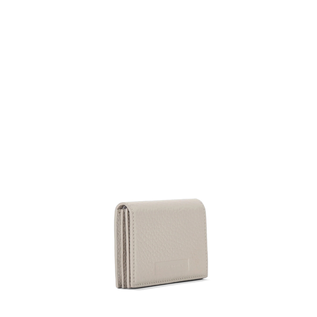 Dagne Dover Accordion Card Case in white seen from an angle.