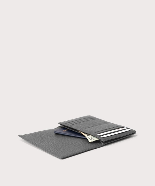 dagne-2025-Dagne Dover Accordion Travel Wallet in grey opened, revealing the internal card slots and internal gusseted card and passport slots.