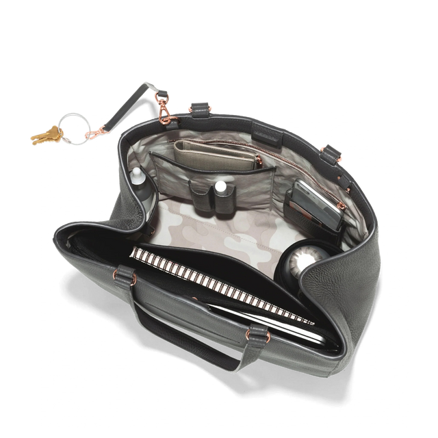 hover - Dagne Dover large Allyn Tote in medium grey with objects inside the interior pockets.