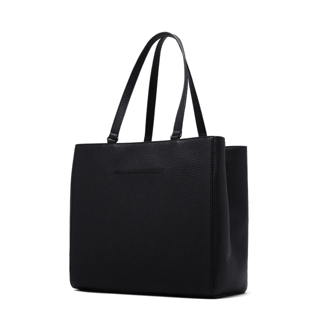 Dagne Dover large Allyn Tote in black with the exterior slip pocket.