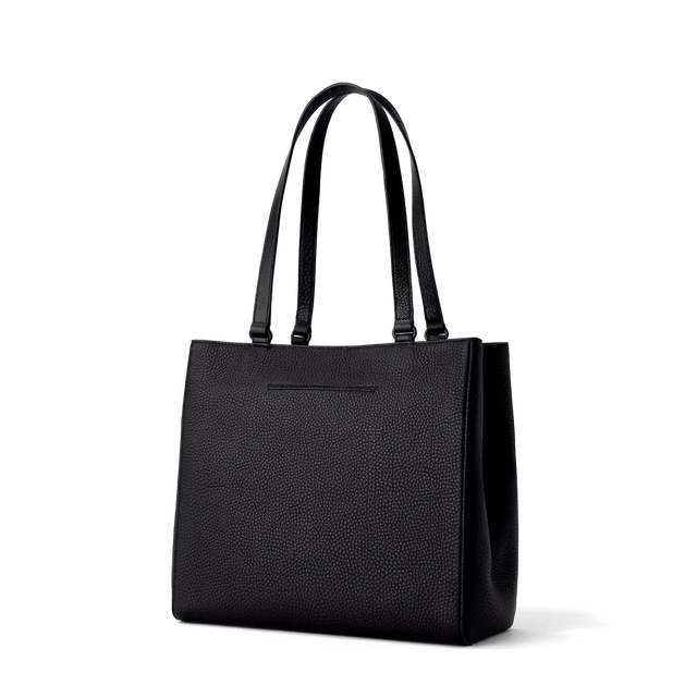Dagne Dover medium Allyn Tote in black with the exterior slip pocket.