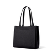 Dagne Dover medium Allyn Tote in black with the exterior slip pocket.