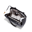hover - Dagne Dover medium Allyn Tote in black with objects inside the interior pockets.