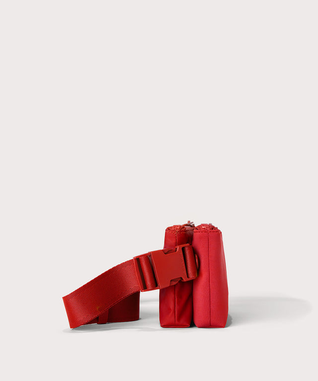 Dagne Dover Bennie Sling in a fiery, saturated red leaning toward orange seen from the side.