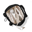 hover - Dagne Dover Kal Drawstring Tote in black opened to reveal the interior slip and zipper pocket.