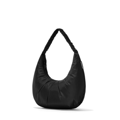 Dagne Dover Rider Shoulder Bag in black seen from an angle.
