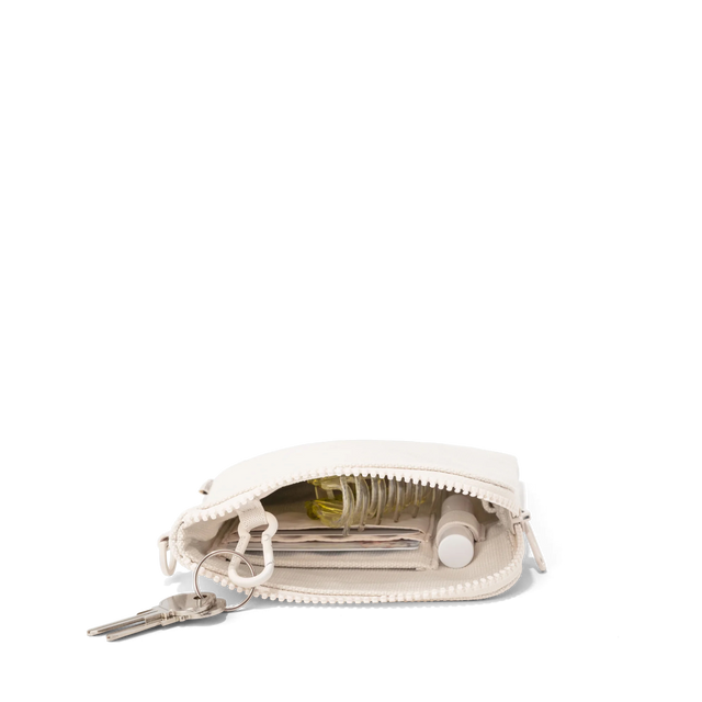 hover - Dagne Dover organic cotton Skye Essentials Pouch in white unzipped, revealing the interior elastic loop, interior air mesh phone pocket, and interior air mesh slip pocket.