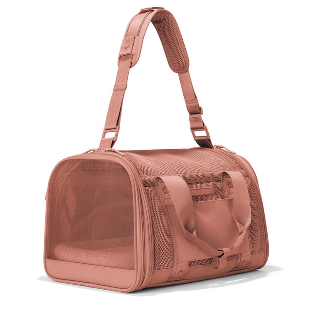 Dagne Dover Large Kyoto Pet Carrier in a warm dust pink seen from a back angle with crossbody strap.