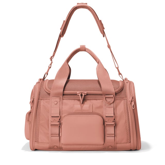 Dagne Dover Large Kyoto Pet Carrier in a warm dust pink seen from the front with crossbody strap.