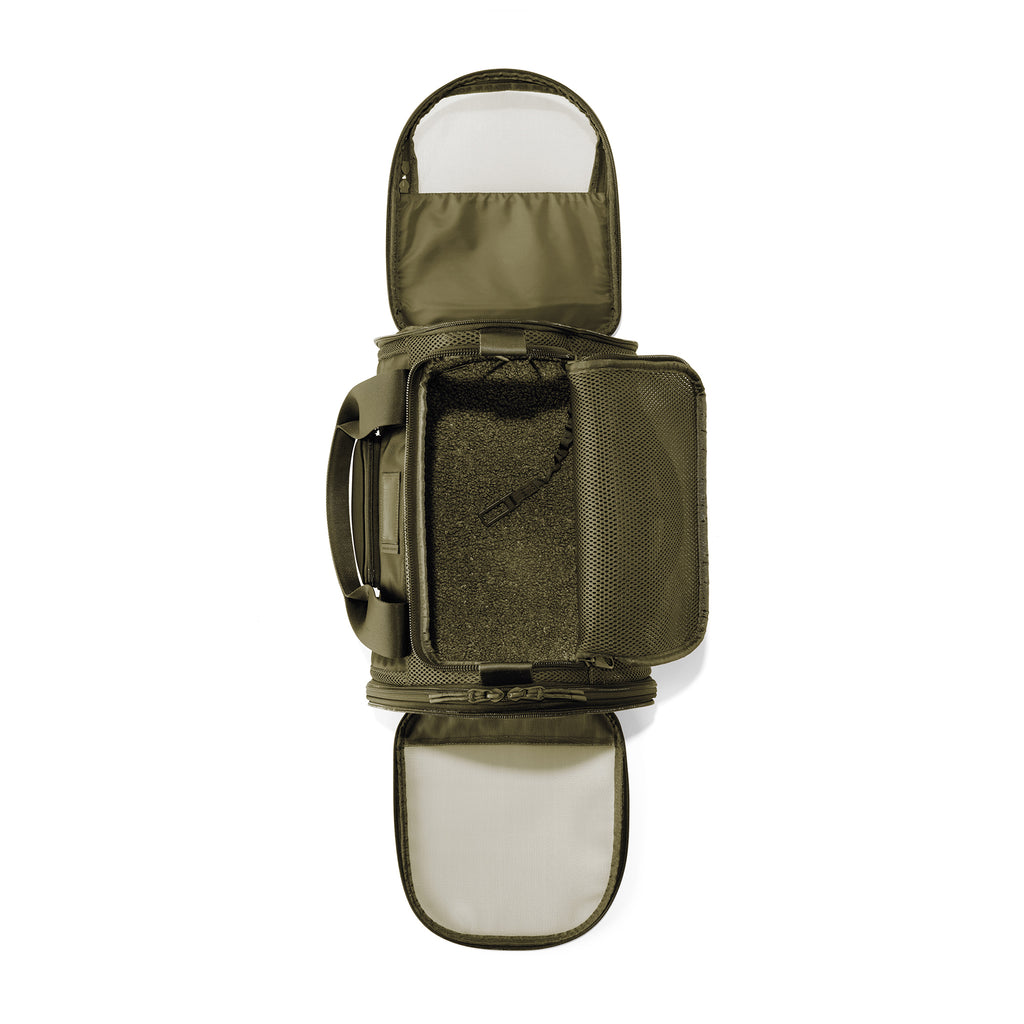 Dagne Dover Small Kyoto Pet Carrier in a deep olive green seen unzipped, top down view.