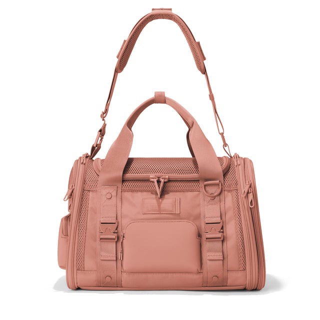 Dagne Dover Small Kyoto Pet Carrier in a warm dust pink seen from the front with crossbody strap.