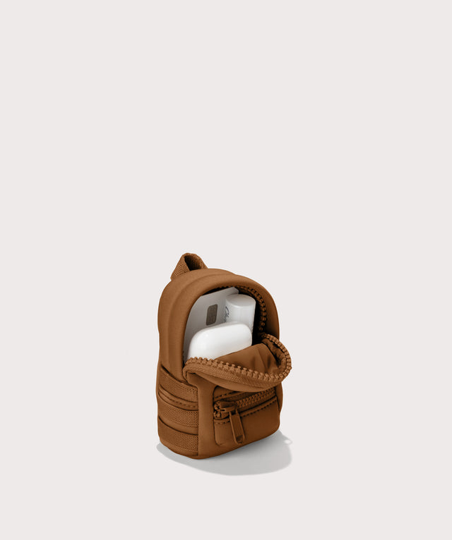 Dakota keychain in a saturated, warm medium-brown with burnt orange undertones. unzipped, top down view. 
