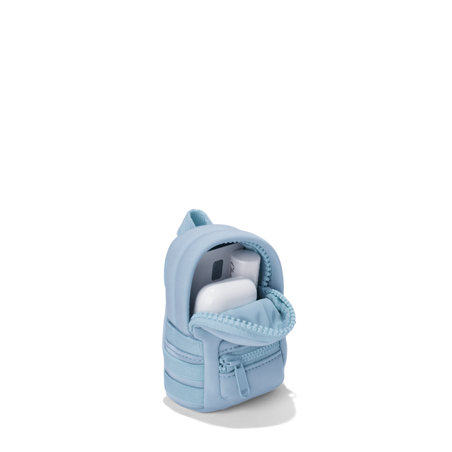 Dagne Dover Dakota Keychain in an airy, lighter sky blue unzipped, showing interior.
