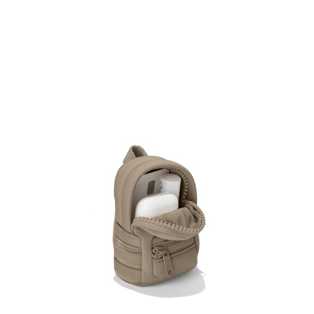 Dagne Dover Dakota Keychain in a medium-dark, creamy tan unzipped, showing interior.