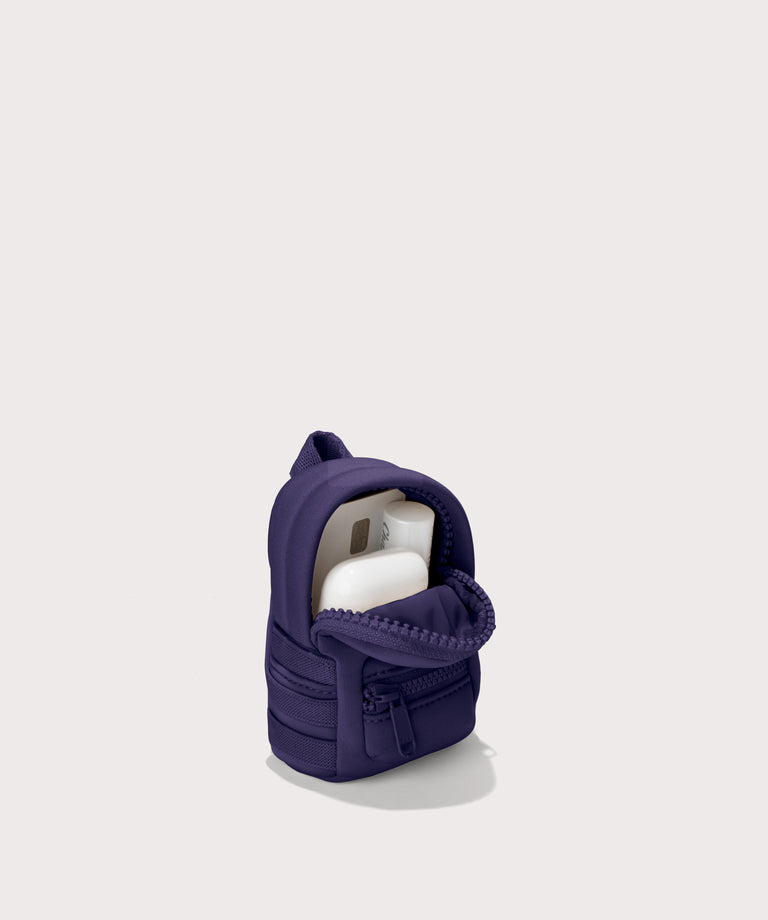 Dakota keychain in a a jewel-toned, deep blue with strong purple undertones.s. unzipped, top down view. 

