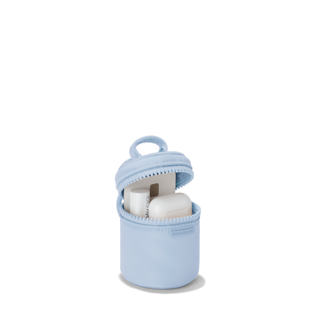 Dagne Dover Mila Keychain in an airy, lighter sky blue unzipped, showing interior.
