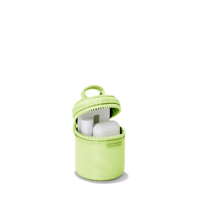 Dagne Dover Mila Keychain in a vibrant, creamy green unzipped, showing interior.
